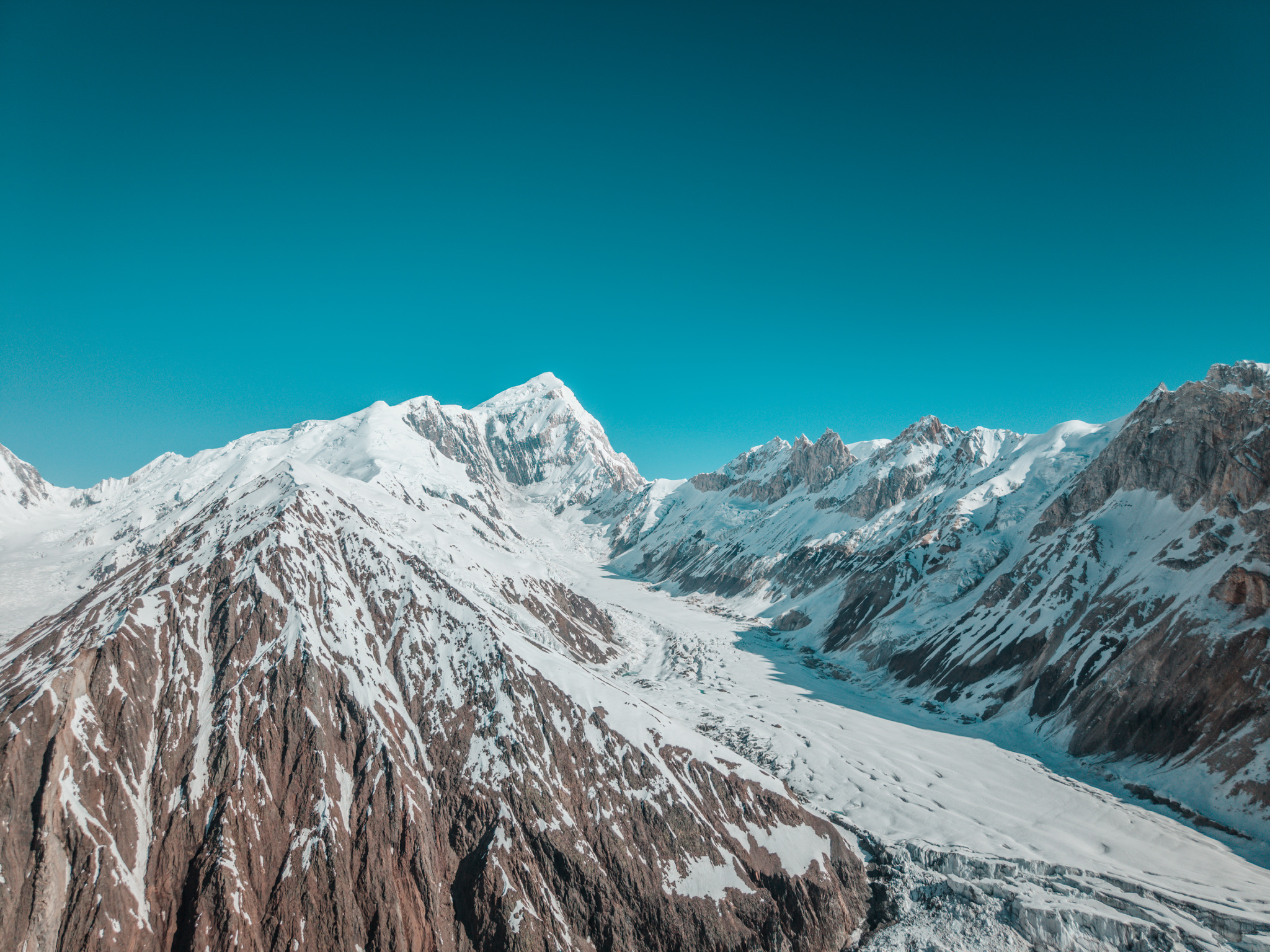 Aerial perspective of snow and rock on the Spantik massif